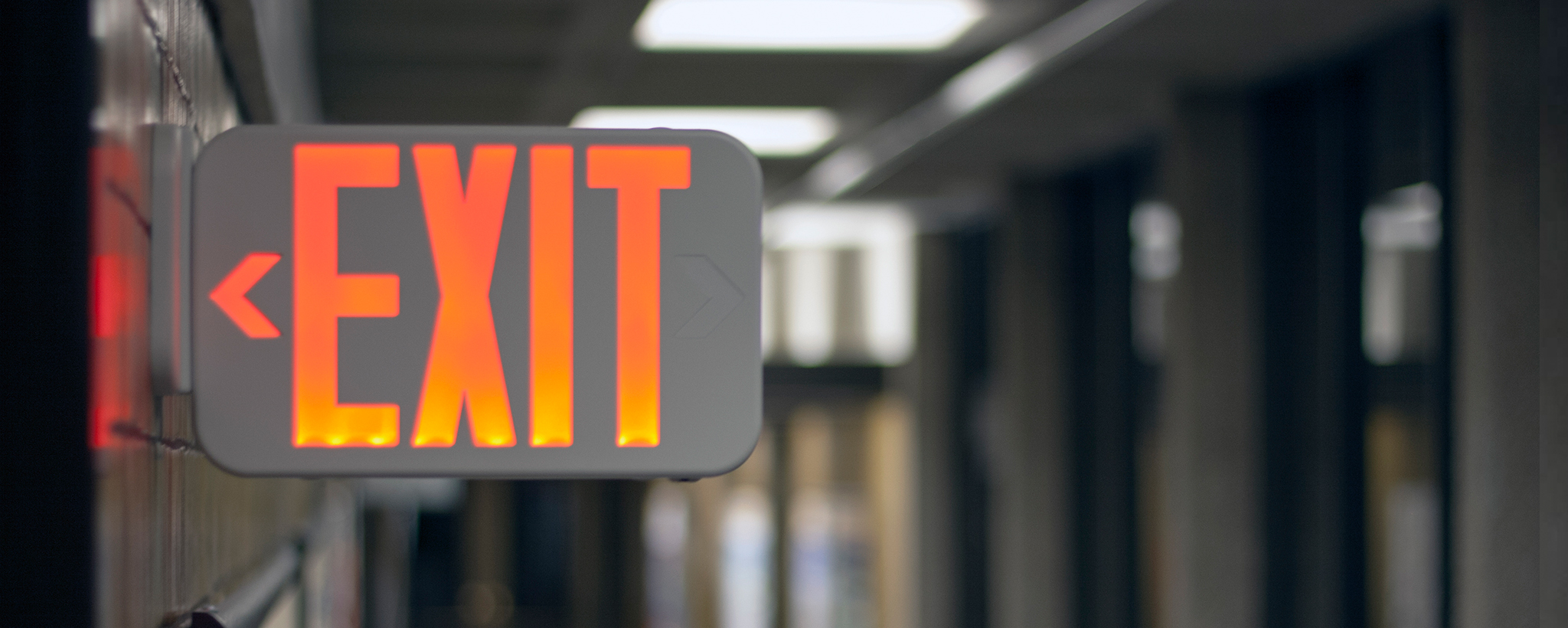 Exit sign in a building hallway