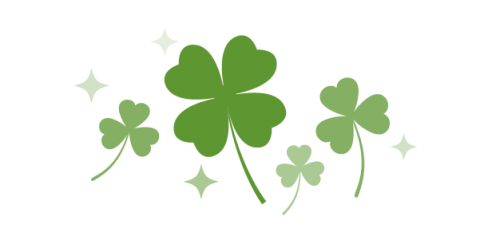 Illustration of several three leaf shamrocks and one four leaf clover in the middle. 