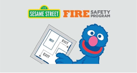 Grover from Sesame Street holding an evacuation plan 