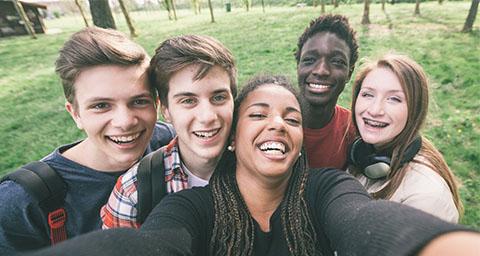 Teens taking a selfie. 